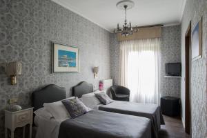 TV a/nebo společenská místnost v ubytování Hotel Residenza In Farnese