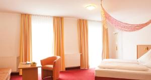 Postel nebo postele na pokoji v ubytování Hotel Seltenbacher Hof