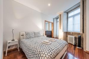 Llit o llits en una habitació de GuestReady - City central suite in Porto