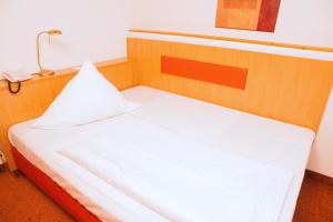 Postel nebo postele na pokoji v ubytování Hotel Seltenbacher Hof