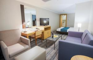 TV a/nebo společenská místnost v ubytování Housez Suites & Apartments Special Class