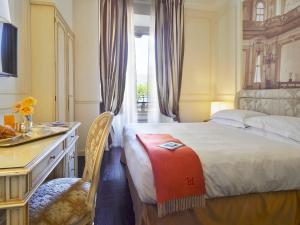 Кровать или кровати в номере Albergo Terminus