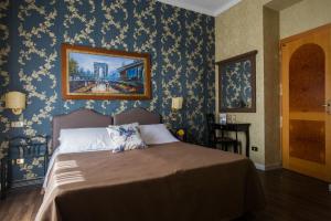 Postel nebo postele na pokoji v ubytování Hotel Residenza In Farnese