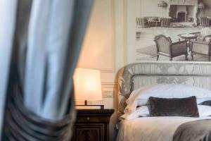 Кровать или кровати в номере Albergo Terminus