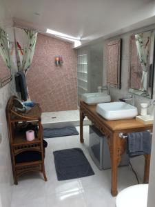 a bathroom with a sink and a tub at Villa Erresiñolettean in Ciboure +18 photos