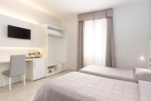 Postel nebo postele na pokoji v ubytování Hotel University + 37 fotografií