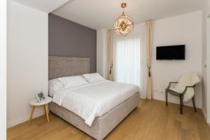 Postel nebo postele na pokoji v ubytování Perla Apartmani Split