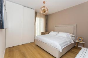 Postel nebo postele na pokoji v ubytování Perla Apartmani Split