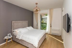Postel nebo postele na pokoji v ubytování Perla Apartmani Split
