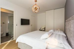 Postel nebo postele na pokoji v ubytování Perla Apartmani Split