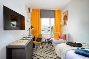 Łóżko lub łóżka w pokoju w obiekcie Arche Hotel Poloneza