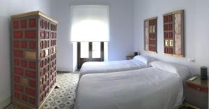 Ein Bett oder Betten in einem Zimmer der Unterkunft Casa del Portillo-Centro Histórico