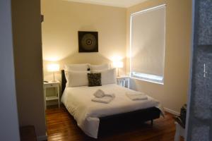 Uma cama ou camas num quarto em Pao 100 Pressa