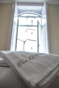 Uma cama ou camas num quarto em Pao 100 Pressa