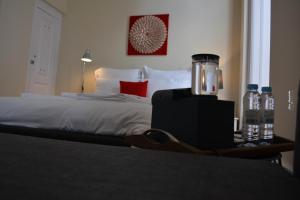 Uma cama ou camas num quarto em Pao 100 Pressa