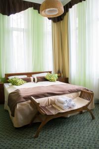Postel nebo postele na pokoji v ubytování Petra Hotel