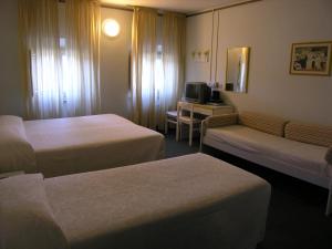 Postel nebo postele na pokoji v ubytování Elba Hotel