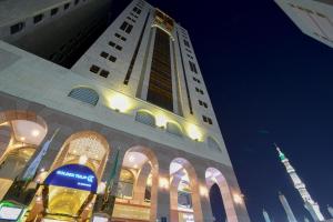 a building with a samsung sign in front of it at Golden Tulip Al-Zahabi in Medina