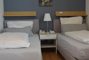 Кровать или кровати в номере Hotel Hages