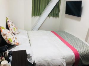 Postel nebo postele na pokoji v ubytování GreenHotel
