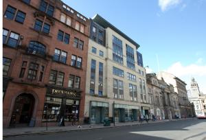 a group of buildings on a city street at The Spires Serviced Apartments Glasgow in Glasgow