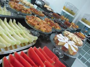 a buffet with many different types of food on display at Hotel Piramide in Eldorado