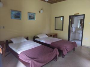 Säng eller sängar i ett rum på Big Foot Safari Lodge