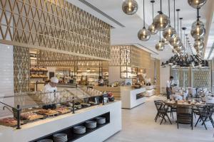 
a kitchen filled with lots of counter top space at Al Bandar Rotana – Dubai Creek in Dubai
