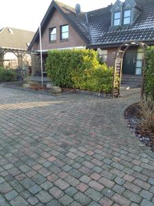 a brick driveway in front of a house at Katharina in Kempen