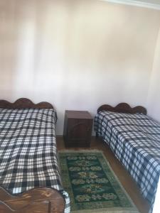 Postel nebo postele na pokoji v ubytování Guest House Nana in Mestia