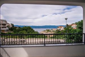a balcony with a view of the water at Apartments Stasic in Vrbnik