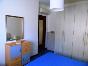 A bed or beds in a room at Deiva Holidays