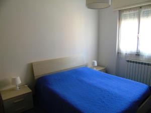 A bed or beds in a room at Deiva Holidays