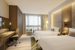 Postel nebo postele na pokoji v ubytování Al Bandar Arjaan by Rotana – Dubai Creek