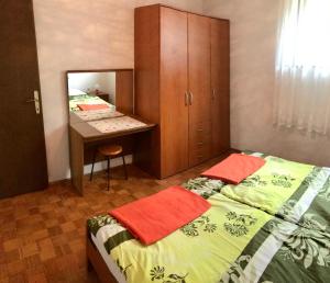 Postel nebo postele na pokoji v ubytování Apartments Markelj