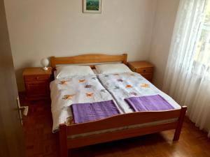 Postel nebo postele na pokoji v ubytování Apartments Markelj