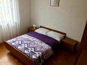 Postel nebo postele na pokoji v ubytování Apartments Markelj