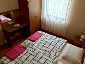 Postel nebo postele na pokoji v ubytování Apartments Markelj