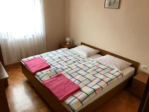 Postel nebo postele na pokoji v ubytování Apartments Markelj