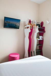 a room with four mannequins on a wall at L'Esterel in Cannes
