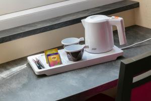 a coffee maker on a tray on a counter at L'Esterel in Cannes