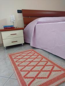 A bed or beds in a room at Tra Mare e Monti