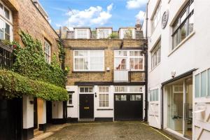 an empty alleyway in a building with buildings at Oxford Circus Apartments in London