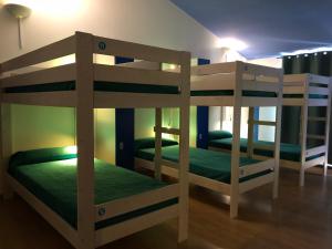 a couple of bunk beds in a room at Hostel Menorca in Ciutadella