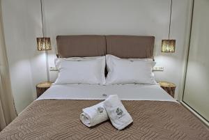 Postel nebo postele na pokoji v ubytování Seashell Seafront Villa
