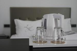 Postel nebo postele na pokoji v ubytování Lazza Hotel