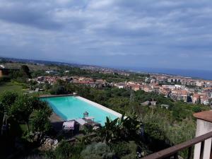 a swimming pool with a view of a city at La casa del panorama in Valverde