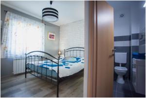 Postel nebo postele na pokoji v ubytování House Mellifera