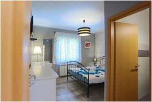 Postel nebo postele na pokoji v ubytování House Mellifera