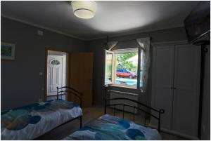 Postel nebo postele na pokoji v ubytování House Mellifera